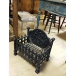 Vintage cast iron fire basket with decorated back panel