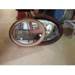 Two oval period mirrors, highly decorative