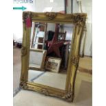 Large gilt framed mirror, bevelled edge glass.  Frame measures 120 x 87 cm