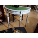 Painted demi-lune table, emerald green leather inlaid top, drawer to front. 75.5 cm wide