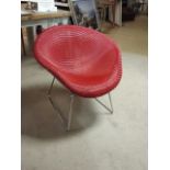 Lloyd Loom contemporary  "Nemo" chair in red. 79 cm wide, 66 cm deep, 74 cm high. (some wear).