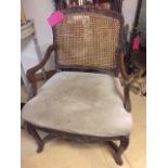 Antique French provincial walnut armchair on cabriole legs, Louis XIV style.