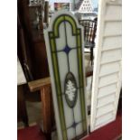 Four stained style glass panels, overall measure 27 cm x 101 cm