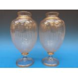 A pair of Baccarat glass mantel vases wi