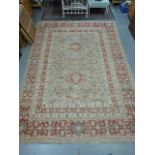A large red & beige ground Persian carpe
