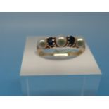 A 14ct gold ring set with sapphires and