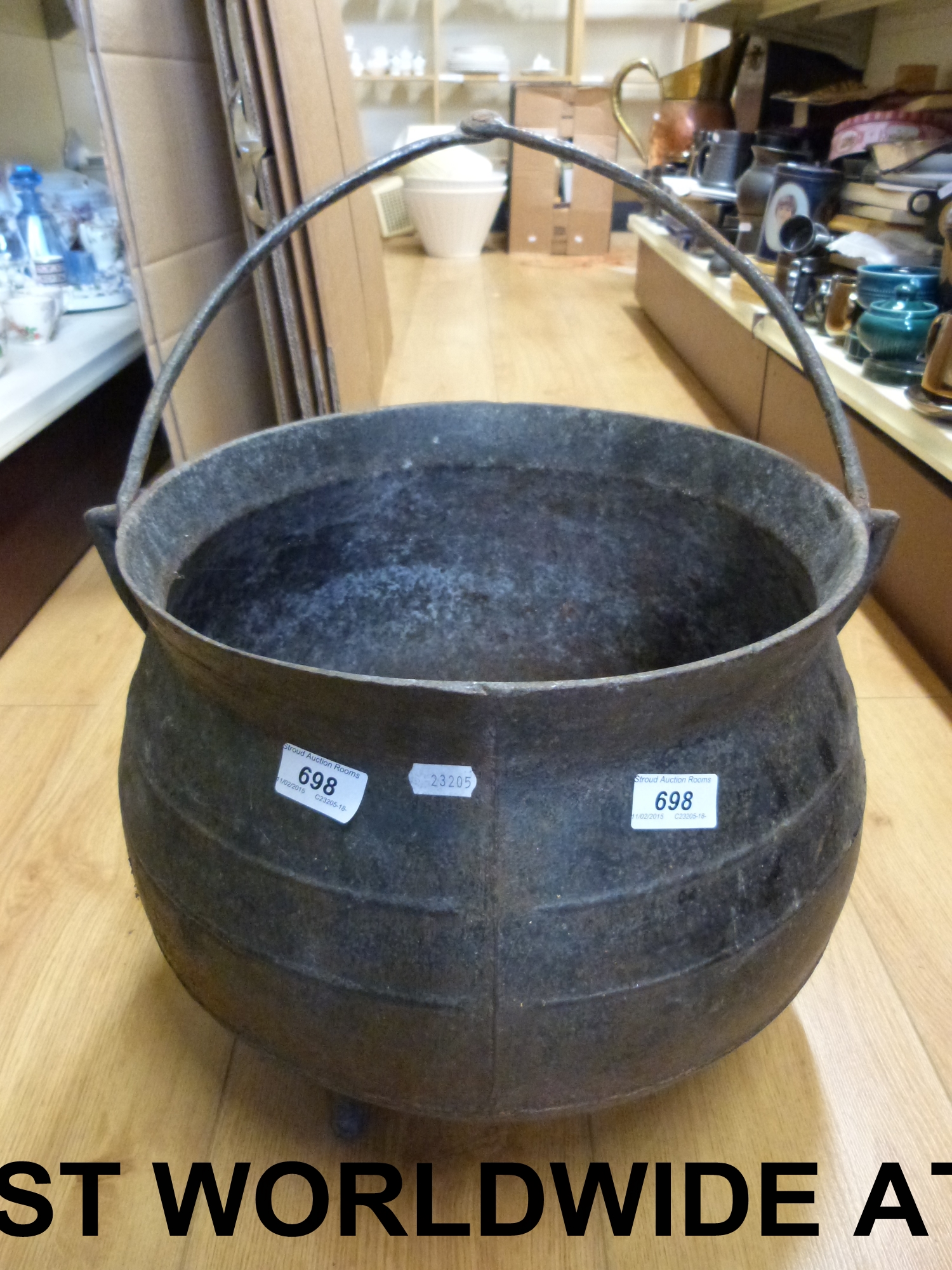 An 18thC / 19thC cast iron cauldron rais