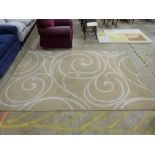 A beige rug with swirl design