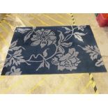 A navy blue floral rug