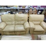 A beige leather two seater sofa and matc