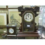 A glass fronted mantel clock striking on