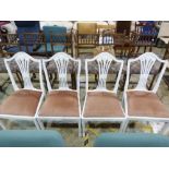 Four white painted dining chairs with up