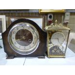A brass cased anniversary clock together