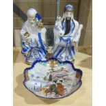 A pair of Oriental style figures togethe