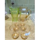 A peach glass lemonade set comprising ju