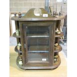 A small wall mounted display cabinet wit
