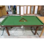 A 1/4 size snooker table with triangle