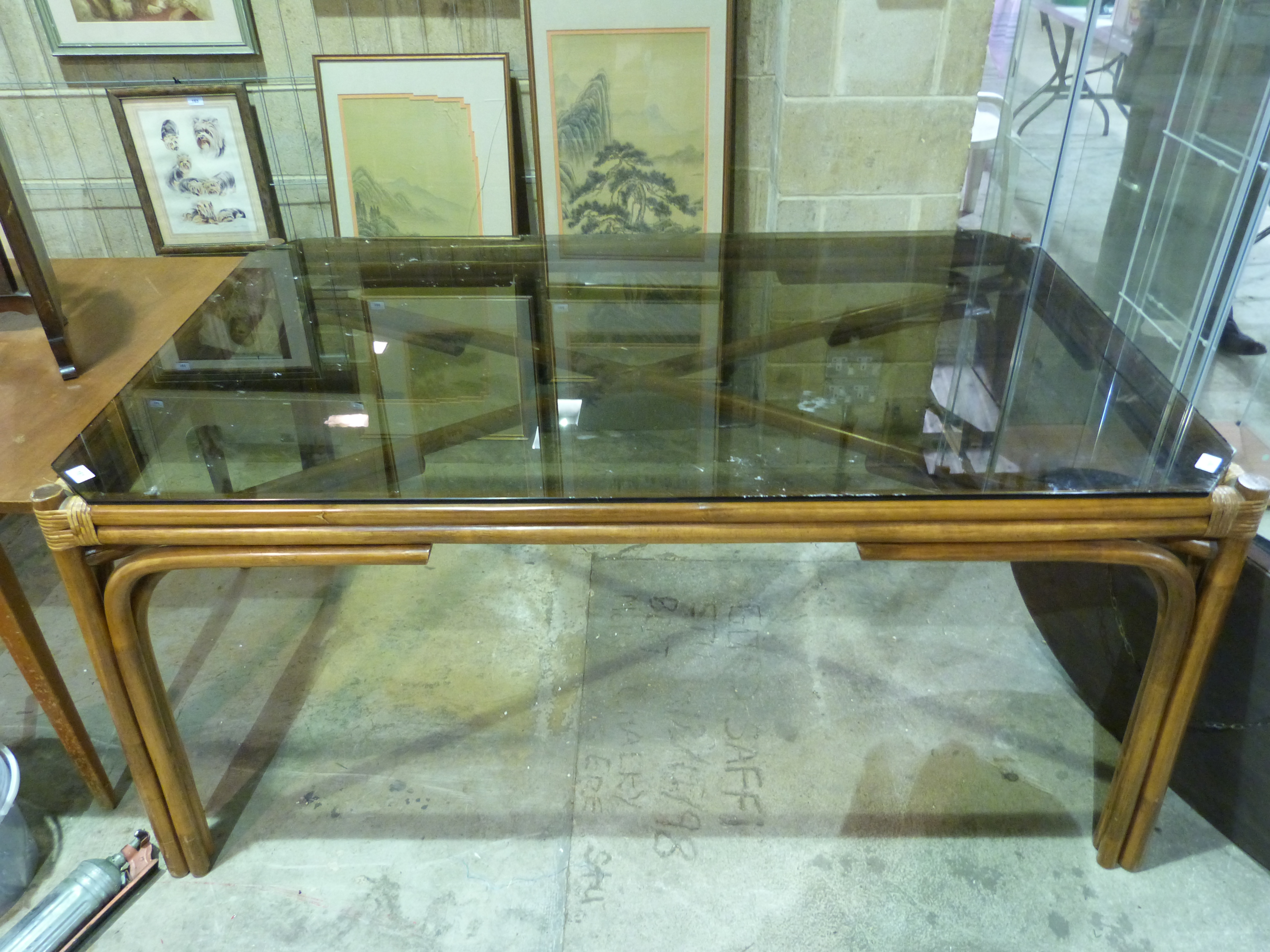 A glass topped conservatory table