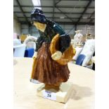 A Henriot Quimper figure of a lady with