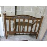 A carved oak Art Nouveau bed head