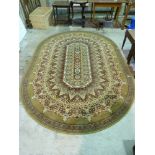 A red and gold oval shaped rug