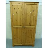 A pine two door wardrobe (W96cm x D54cm