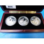 A Queen Mother 80 Years three-coin cased