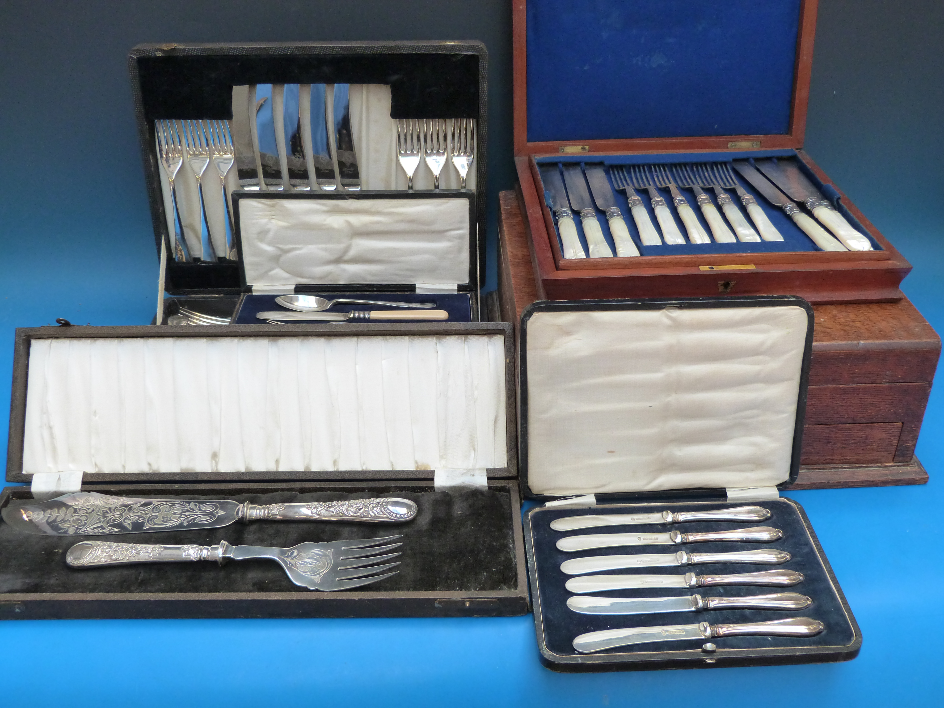 A quantity of cased cutlery including ha