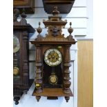 A Vienna regulator style wall clock with