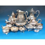 A quantity of plated teapots, jugs etc