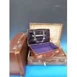 Four various vintage suitcases/attaché c