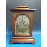 A three train bracket mantel clock with