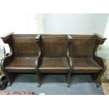 An unusual oak church pew from Winchcomb