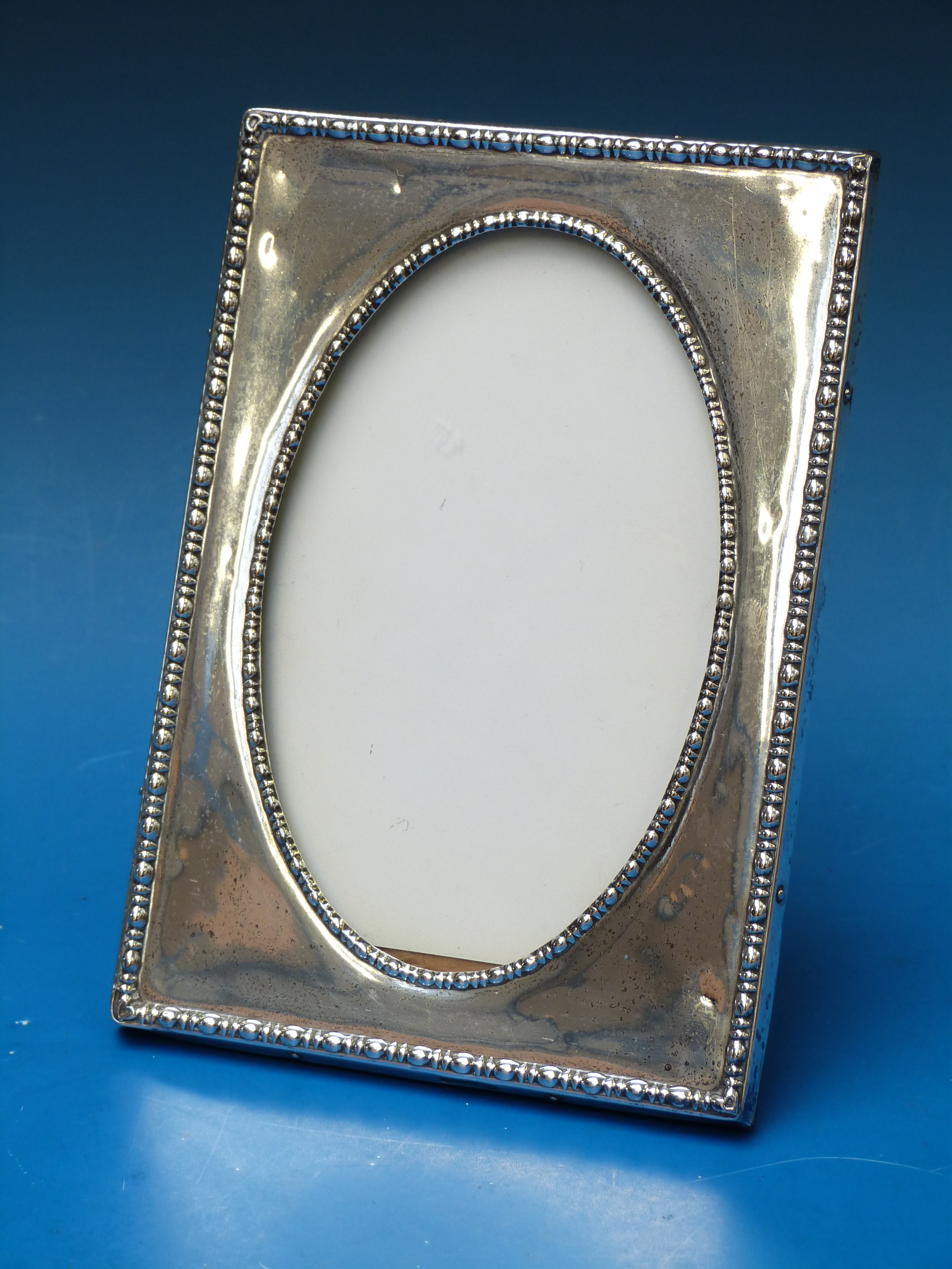 A hallmarked silver photograph frame, he