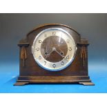 An oak-cased mantel clock with German mo