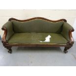 A Victorian upholstered sofa with scroll