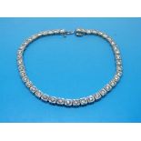 An 18ct white gold tennis bracelet set w