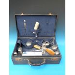 A cased travelling set comprising 11 hal