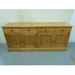 A pine four drawer sideboard (W184 x D45