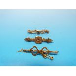 A hallmarked 9ct gold bar brooch set wit