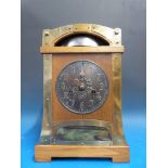 An oak Arts and Crafts mantel clock with