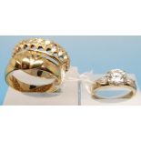 Two 9ct gold rings, one depicting a wate