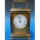 A gilt cased repeater carriage clock wit