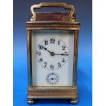 A French carriage clock with ivory colou