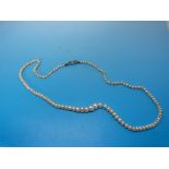 A single string of natural pearls with a