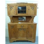 A pine dresser with carved decoration (W