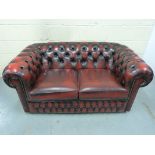 A leather Chesterfield two-seater sofa