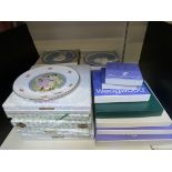 A collection of collectors plates in box