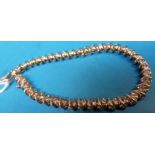 A white gold tennis bracelet marked 14k