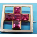 A square yellow metal brooch set with fi